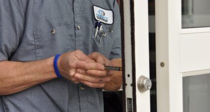 Photo of a door technician working on an automatic door