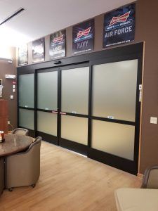 Photo of automatic sliding doors with frosted glass