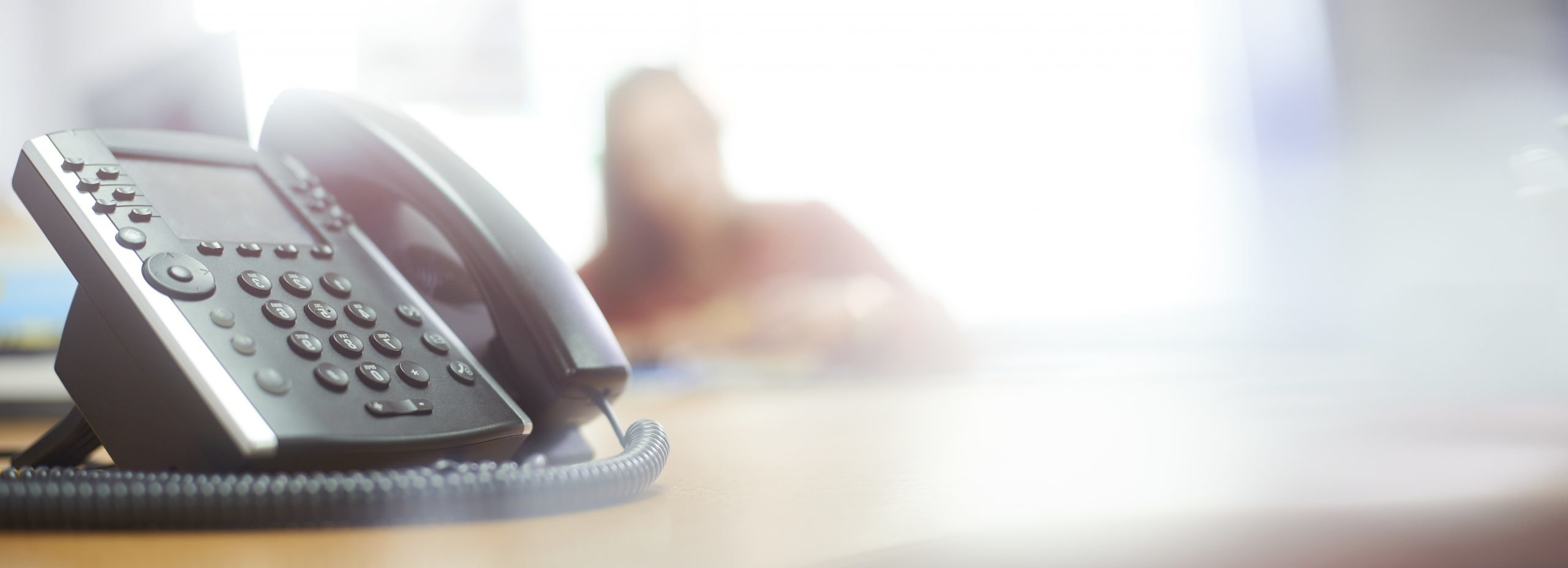 Close-up of telephone in office setting