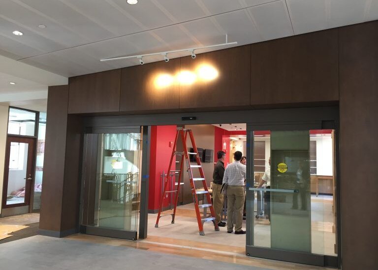 Photo of a door being installed on a construction site