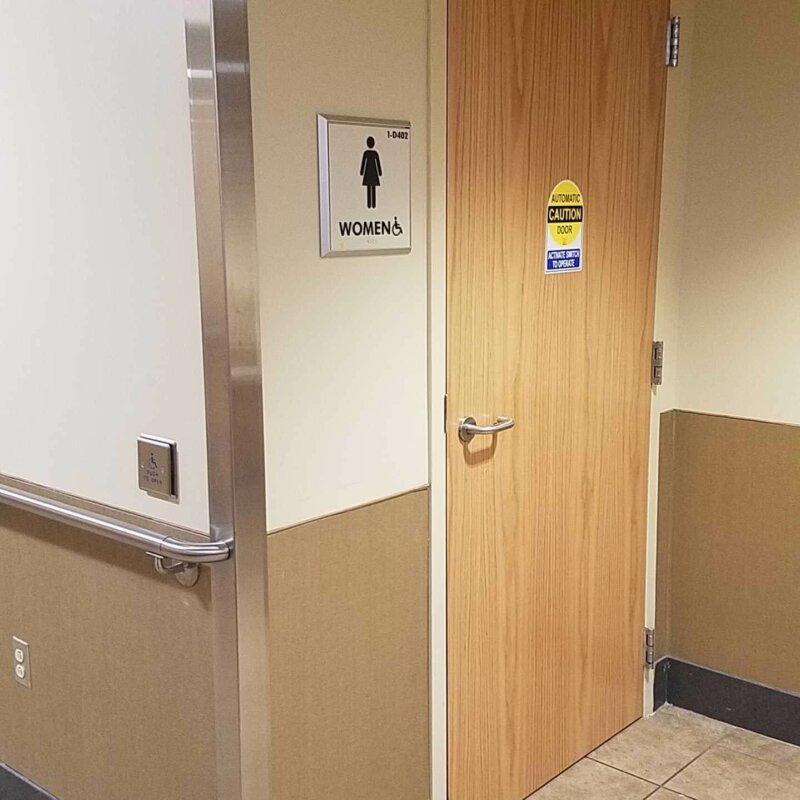 Low Energy Door Operator on Restroom Door